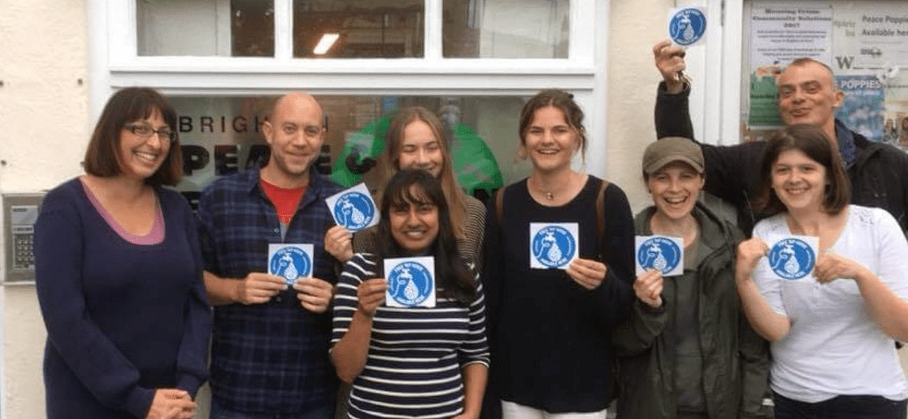 Refill Brighton and Hove Volunteers holding stickers